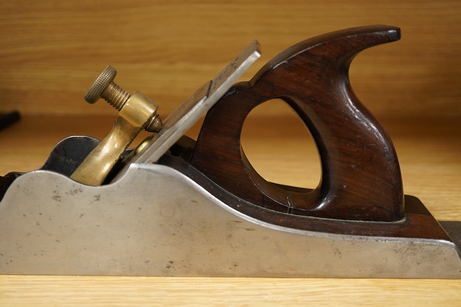 A Stewart Spiers steel 15 1/2” panel plane, stamped with Spiers, Ayr to the brass lever cap, chip breaker and iron, with rosewood infill